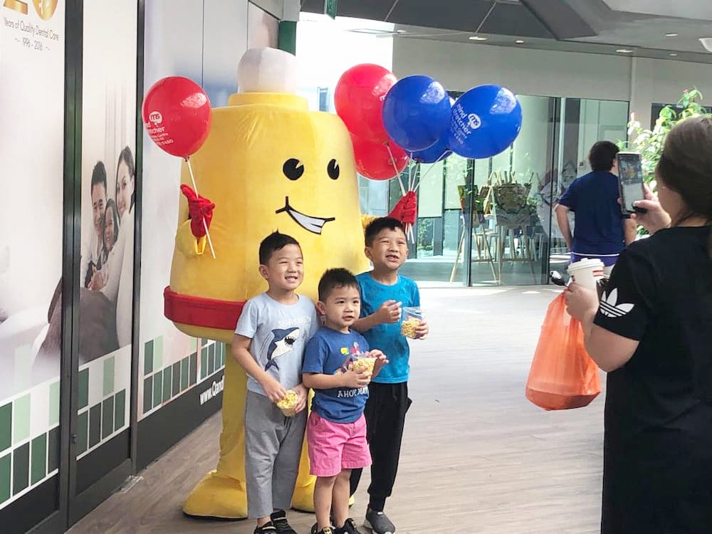 Events-Marketing-Walkway-Flyer-Distribution-Mindstretcher-mascot-with-children.jpg