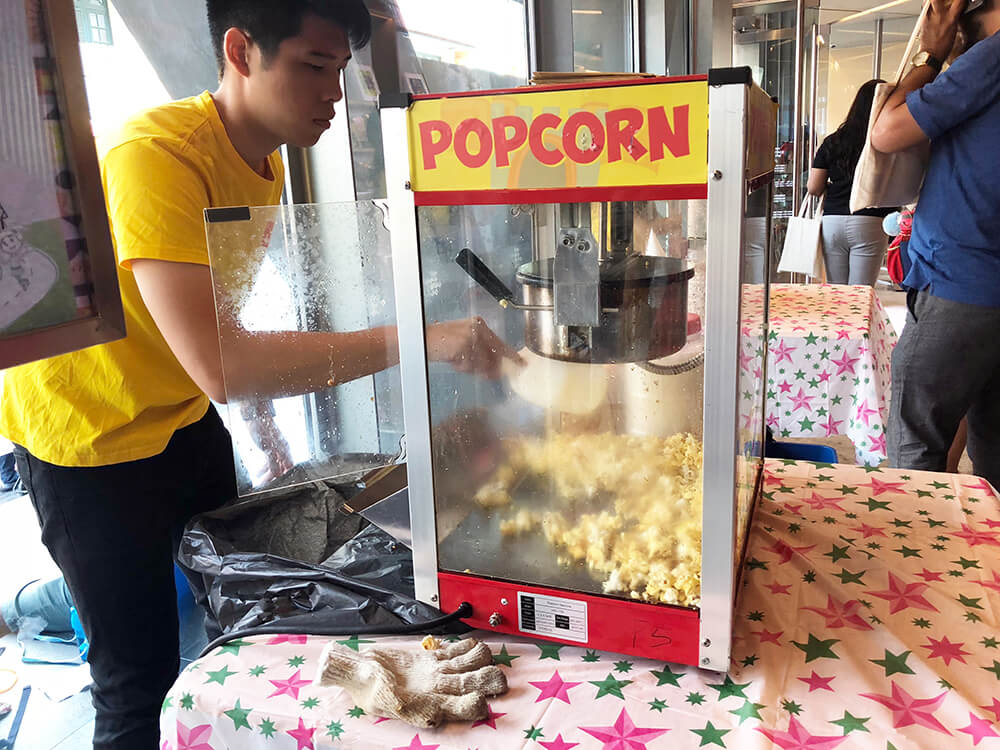 Indian-Heritage-Center-Events-flyer-distribution-marketing-booth-with-popcorn-machine-and-operator.jpg
