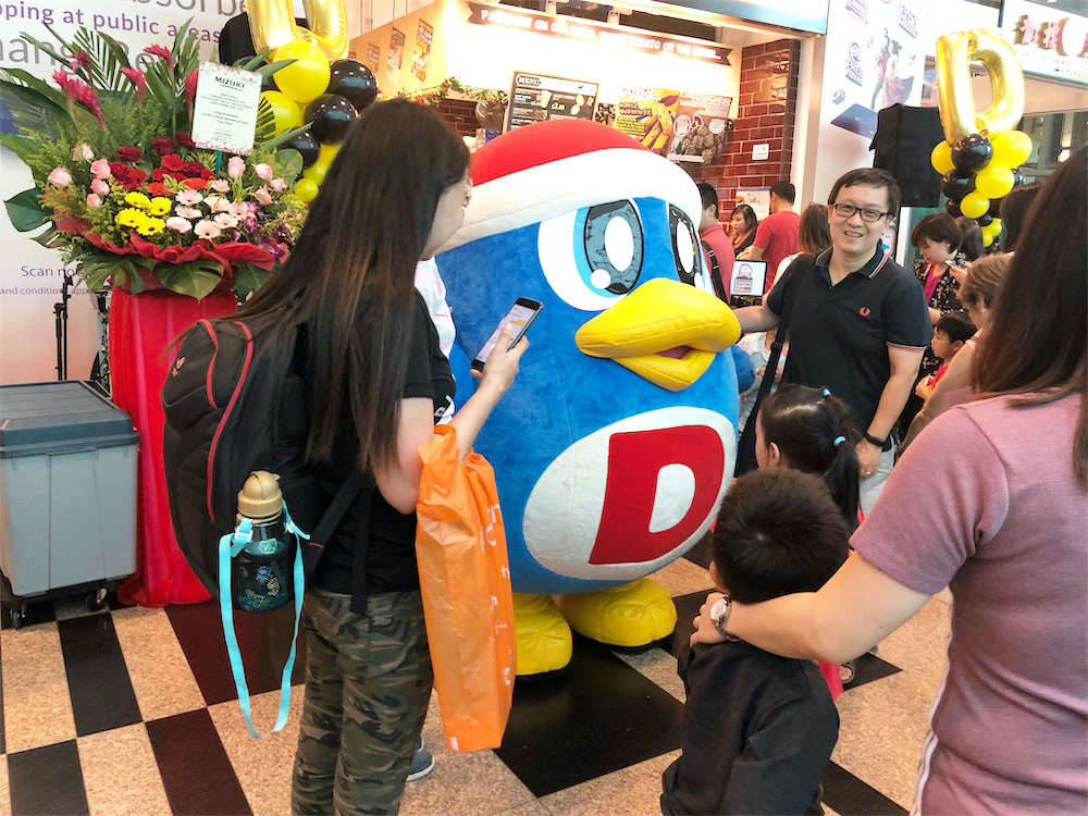 don-don-donki-at-changi-jewel-event-marketing-with-mascot-posing-for-photo-with-people.jpg